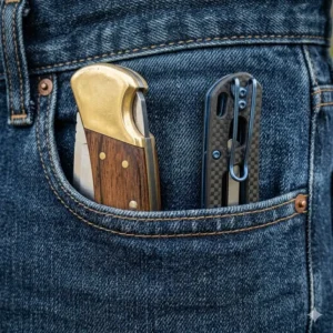 A side-by-side comparison showing how a slim lightweight knife disappears in a pocket compared to a traditional heavy folder.